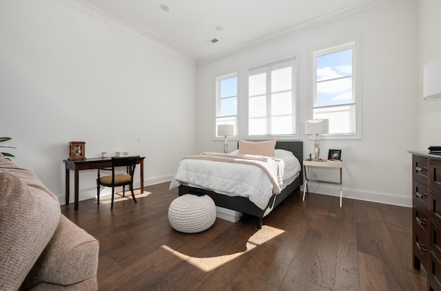 bedroom with ornamental molding, multiple windows, and dark wood-style floors