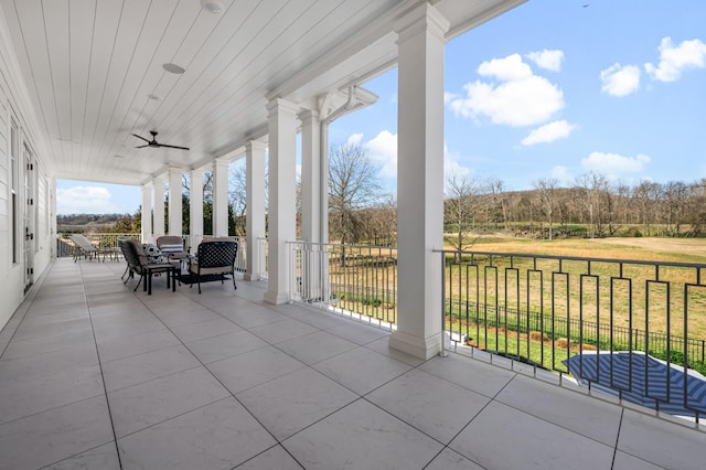 view of patio / terrace featuring a ceiling fan and outdoor dining space