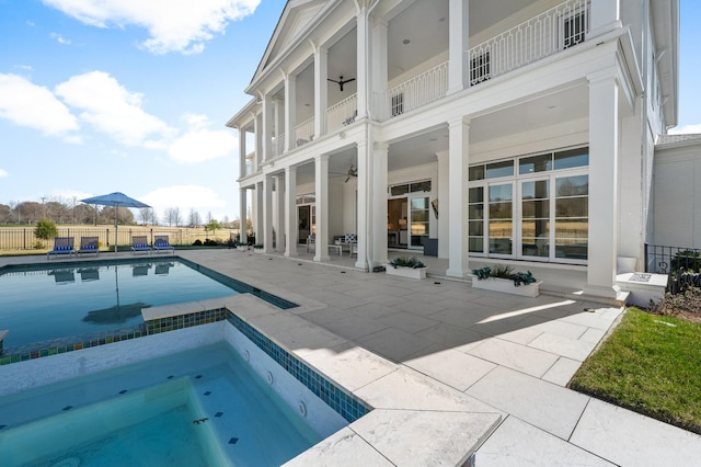 view of pool with ceiling fan, an in ground hot tub, fence, a fenced in pool, and a patio area