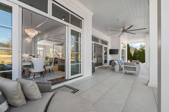 view of patio featuring a ceiling fan and an outdoor living space