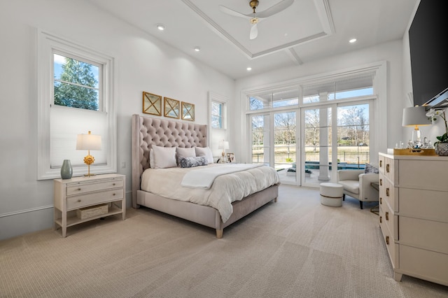 bedroom featuring light carpet, access to outside, multiple windows, and recessed lighting