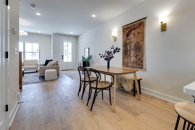 dining area featuring light wood-type flooring, baseboards, and recessed lighting