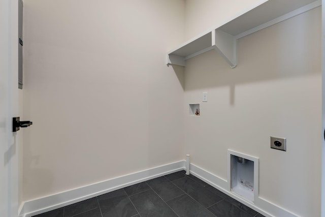 laundry room with hookup for a washing machine, laundry area, dark tile patterned floors, baseboards, and electric dryer hookup