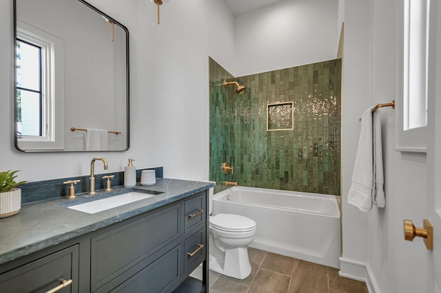 bathroom with tub / shower combination, vanity, and toilet