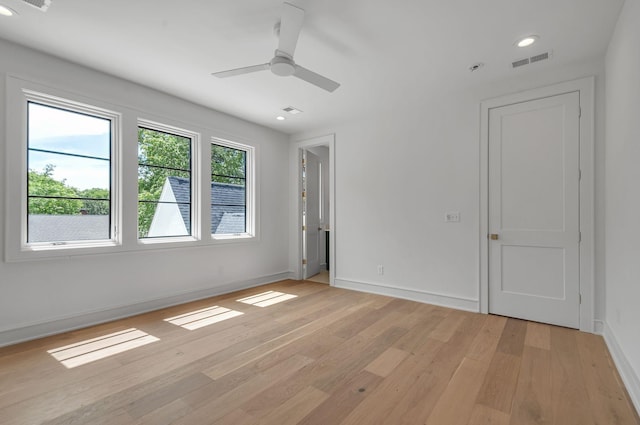 empty room featuring ceiling fan, recessed lighting, visible vents, baseboards, and light wood-style floors