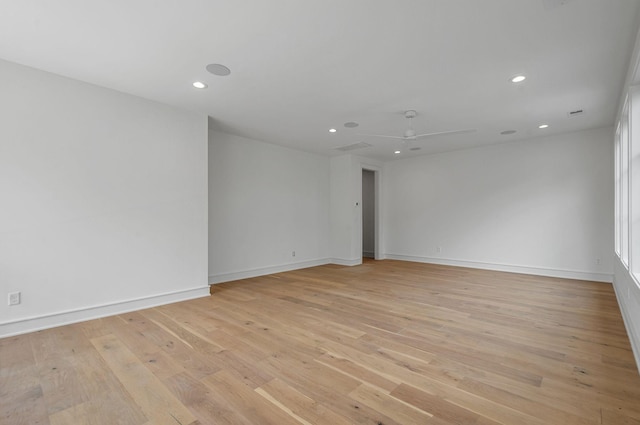 spare room featuring recessed lighting, baseboards, ceiling fan, and light wood finished floors