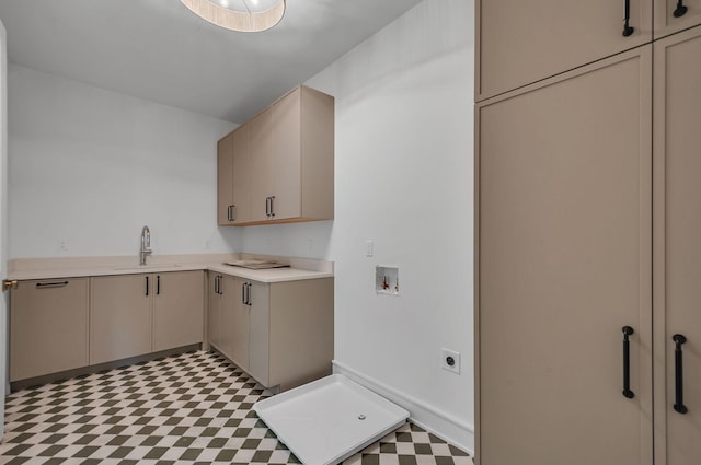 laundry room with hookup for a washing machine, a sink, cabinet space, tile patterned floors, and electric dryer hookup