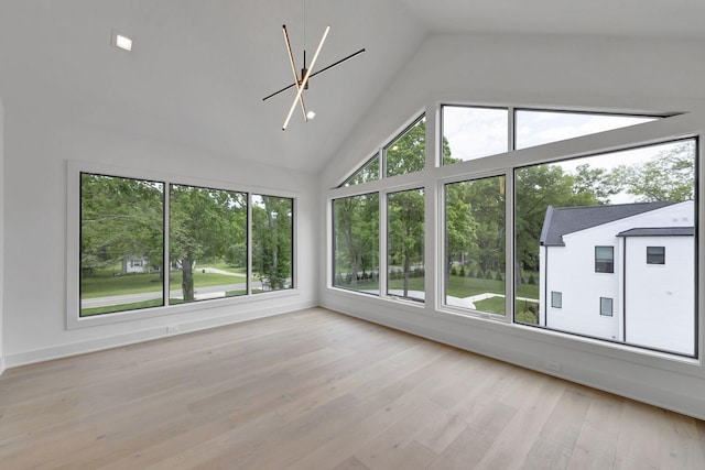 unfurnished sunroom featuring lofted ceiling