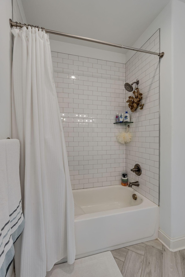 full bathroom with shower / tub combo