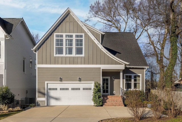 view of front of property with a garage, board and batten siding, driveway, and a shingled roof