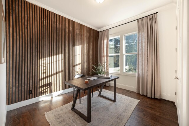 office area featuring crown molding, wood finished floors, visible vents, and baseboards