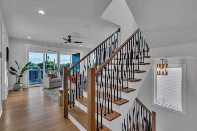 staircase with recessed lighting, ceiling fan, baseboards, and wood finished floors