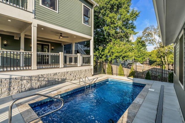 view of swimming pool with a patio area, fence, and a fenced in pool