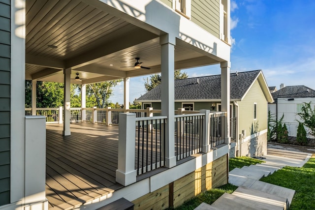 wooden deck with a ceiling fan