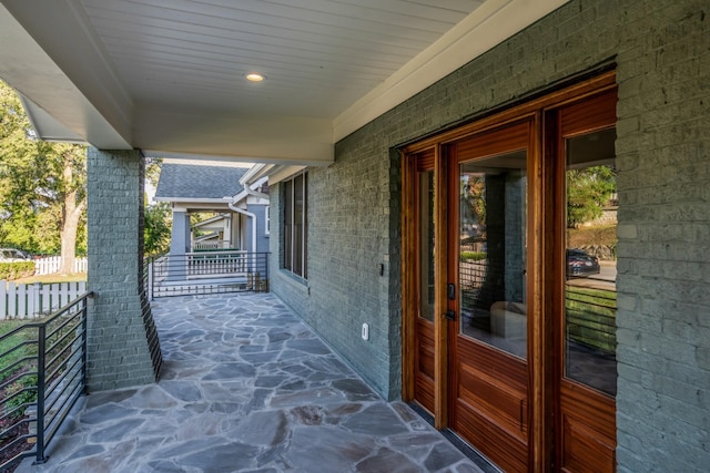 view of patio featuring fence