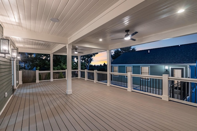 wooden deck featuring a ceiling fan