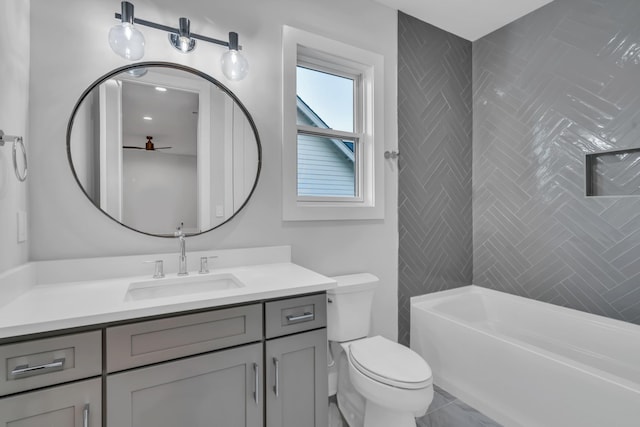 bathroom featuring toilet, shower / bath combination, and vanity