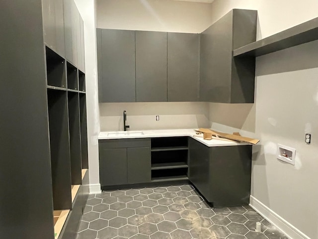 interior space with vanity and baseboards