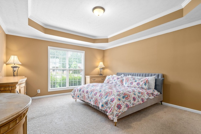 carpeted bedroom featuring a raised ceiling, crown molding, and baseboards