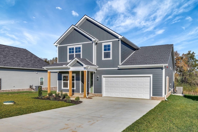 view of front facade with a garage, central AC, concrete driveway, a front lawn, and board and batten siding