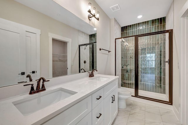 full bath with toilet, marble finish floor, a sink, and visible vents