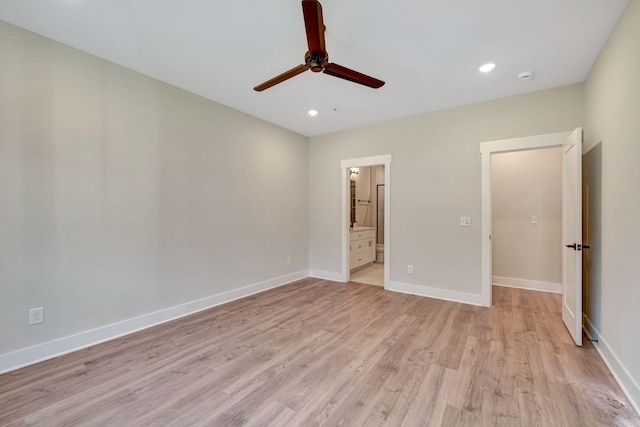 unfurnished bedroom with light wood finished floors, baseboards, and recessed lighting