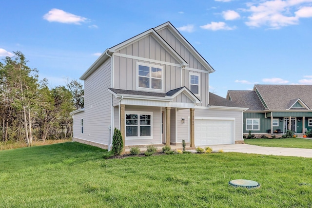 craftsman house featuring a garage, driveway, board and batten siding, and a front yard