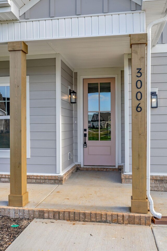 doorway to property featuring a porch