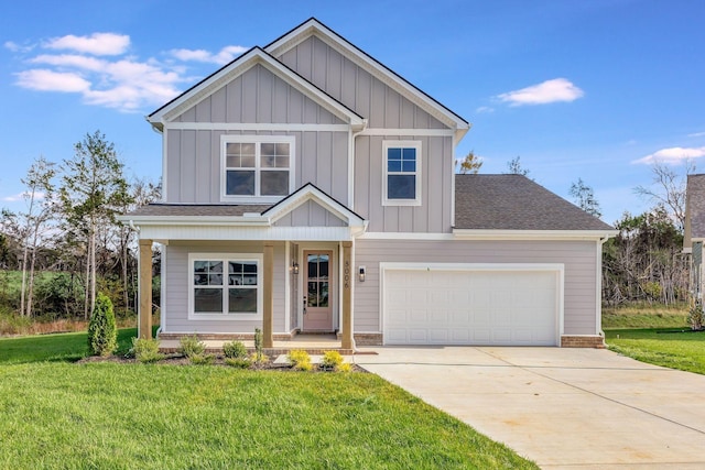 craftsman-style home with concrete driveway, a shingled roof, board and batten siding, and a front yard