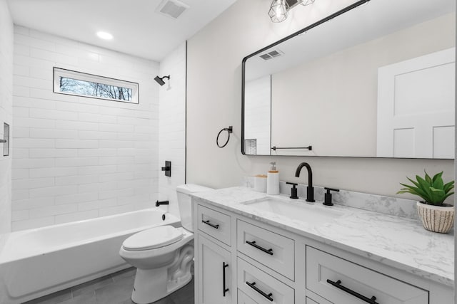 full bath featuring visible vents, vanity, toilet, and shower / bathtub combination