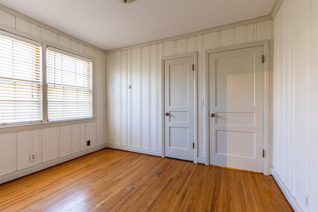 unfurnished bedroom featuring light wood-style floors