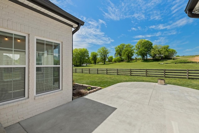 view of patio featuring fence