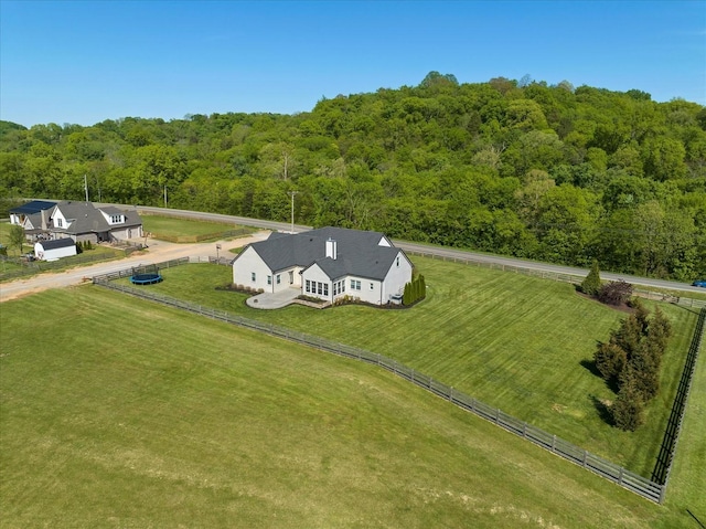 bird's eye view with a view of trees and a rural view