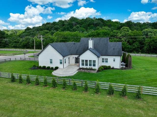 427 Carters Creek Pike, Columbia, TN 38401 - back of house featuring a view of trees and a chimney