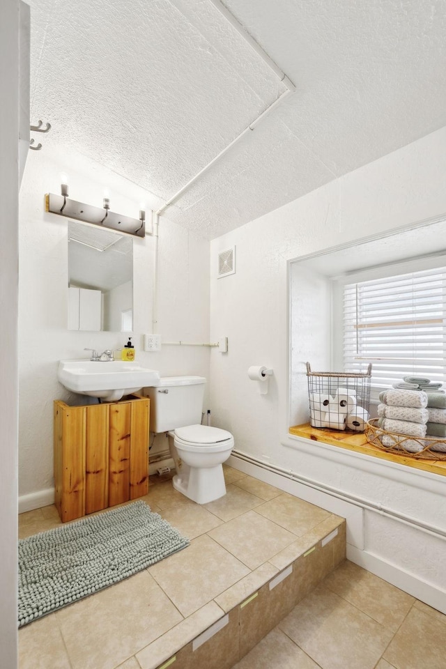 120 Wilkerson Ln, Portland, TN 37148 - bathroom featuring a textured ceiling, toilet, vanity, visible vents, and tile patterned floors