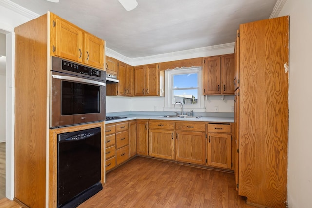 120 Wilkerson Ln, Portland, TN 37148 - kitchen with black appliances, ornamental molding, a sink, and light countertops