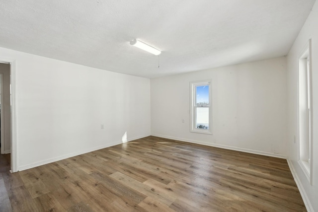 120 Wilkerson Ln, Portland, TN 37148 - empty room with a textured ceiling, wood finished floors, and baseboards