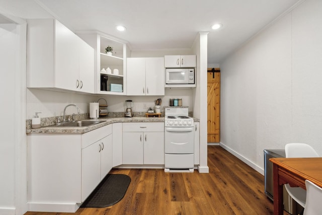 120 Wilkerson Ln, Portland, TN 37148 - kitchen featuring light countertops, a barn door, white cabinetry, a sink, and white appliances