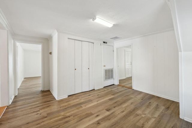 120 Wilkerson Ln, Portland, TN 37148 - unfurnished bedroom with ornamental molding, a closet, wood finished floors, and visible vents