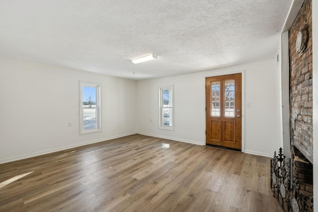 120 Wilkerson Ln, Portland, TN 37148 - foyer entrance with a textured ceiling, baseboards, and wood finished floors