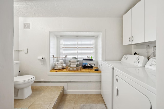 120 Wilkerson Ln, Portland, TN 37148 - laundry area featuring light tile patterned floors, washing machine and dryer, laundry area, visible vents, and baseboards