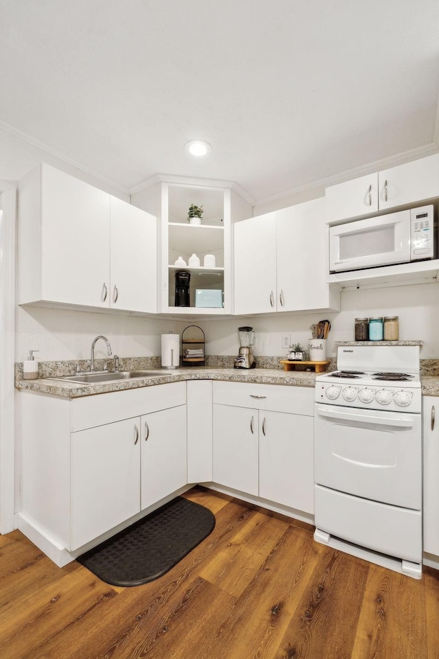 120 Wilkerson Ln, Portland, TN 37148 - kitchen featuring light wood finished floors, light countertops, white cabinets, a sink, and white appliances