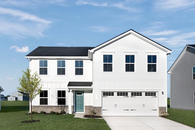 view of front facade featuring driveway, stone siding, board and batten siding, an attached garage, and a front yard