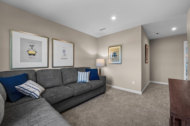 carpeted living area with recessed lighting, baseboards, and visible vents