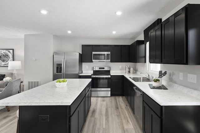 kitchen featuring dark cabinetry and stainless steel appliances