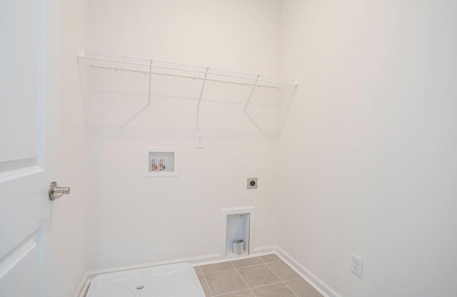 laundry room with light tile patterned floors, hookup for a washing machine, laundry area, baseboards, and electric dryer hookup