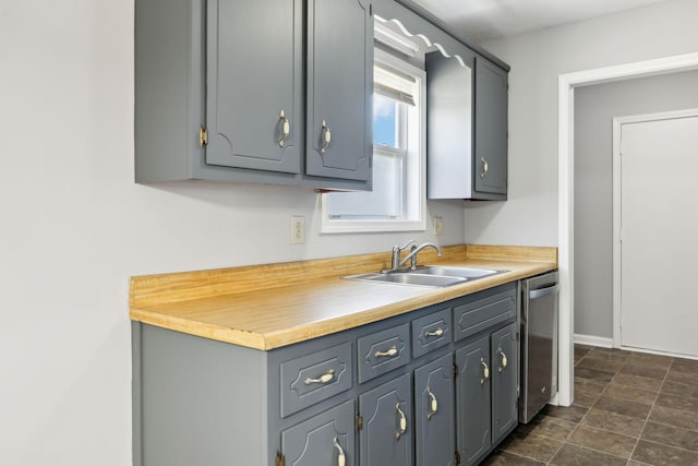 kitchen with gray cabinets and a sink