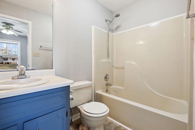 full bath with washtub / shower combination, vanity, toilet, and a ceiling fan