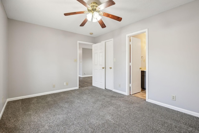 unfurnished bedroom featuring ceiling fan, carpet flooring, connected bathroom, and baseboards