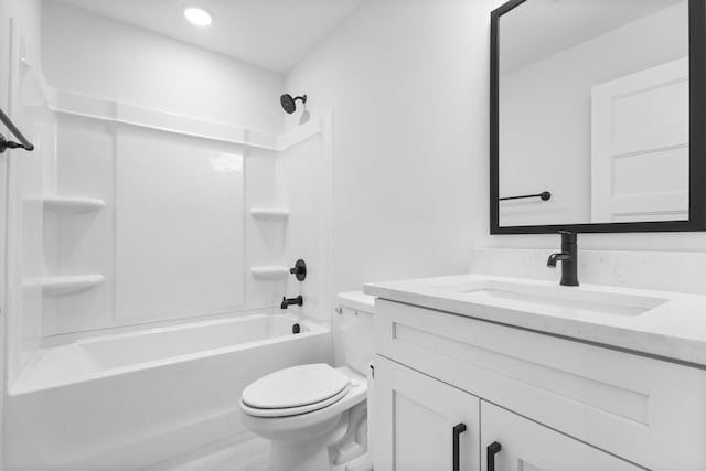 full bath with toilet,  shower combination, and vanity